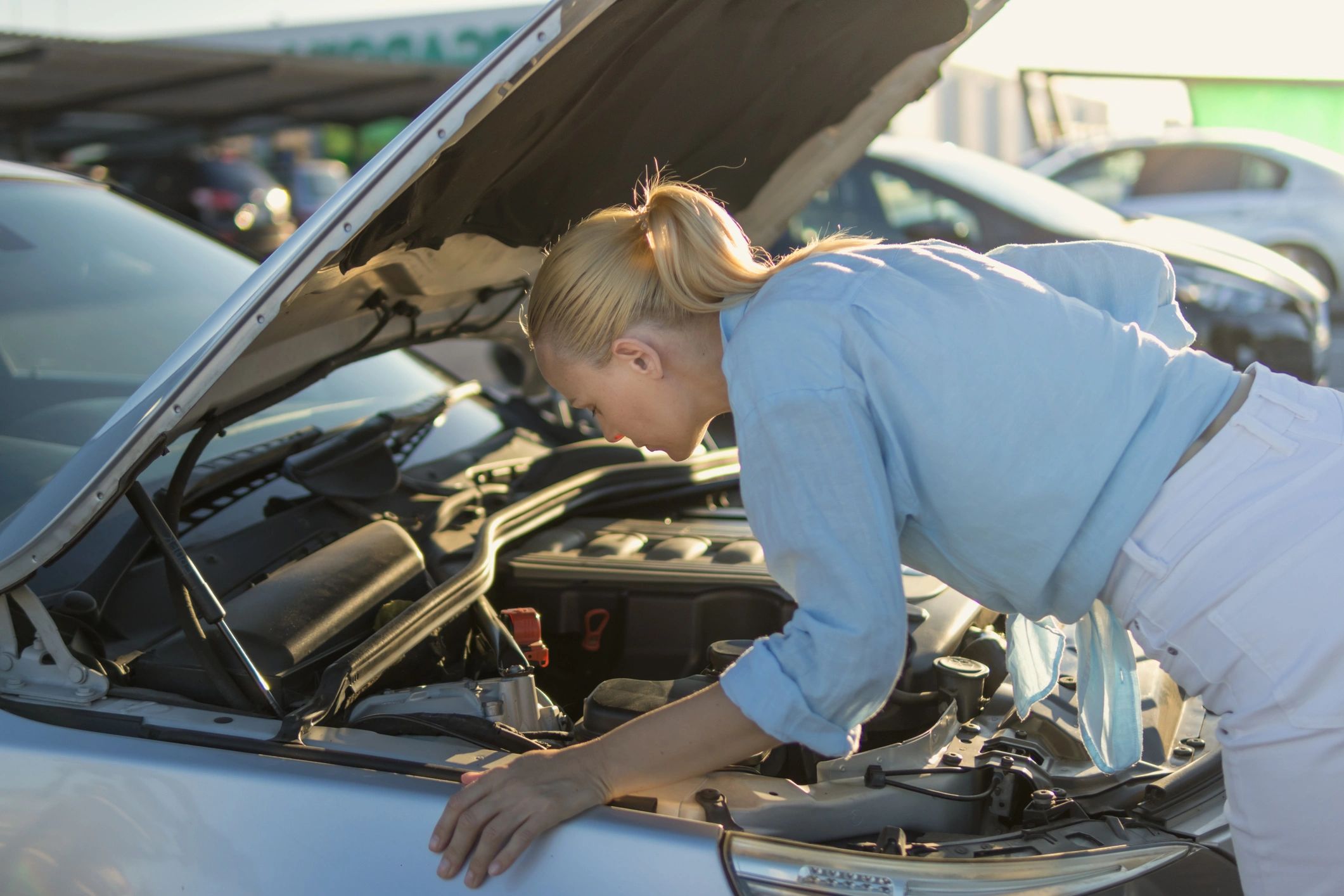 Damaged car being inspected